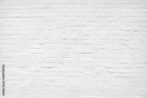 White brick wall, brickwork. Old grunge white painted brick wall texture background. Loft style wall. White brick Industrial abstract background for photos, fabrics, textiles, papers