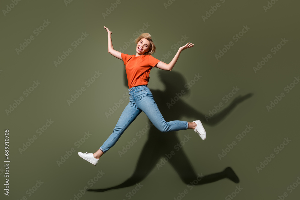 Full body photo of young funny shopaholic raises palms up promoting stylish new clothes outfit look isolated on khaki color background Full body photo of young funny shopaholic raises palms up promoting stylish new clothes outfit look isolated on khaki color background