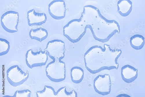 Cream water gel cosmetic lubricant  background transparent smudge blue-gray cooling lotion photo