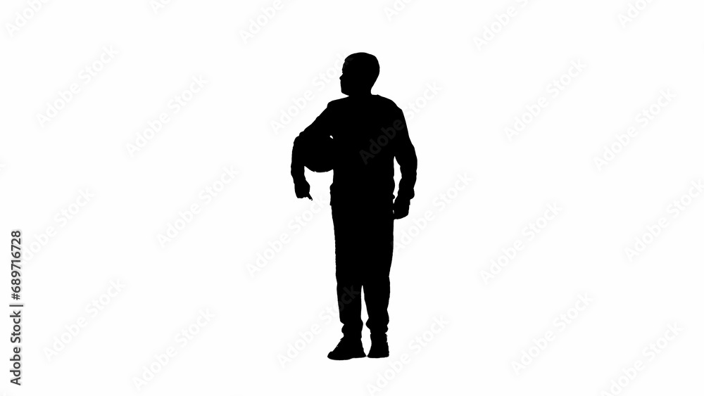 Portrait of kid boy isolated on white background with alpha channel. Silhouette of schoolboy standing posing at the camera with football ball.