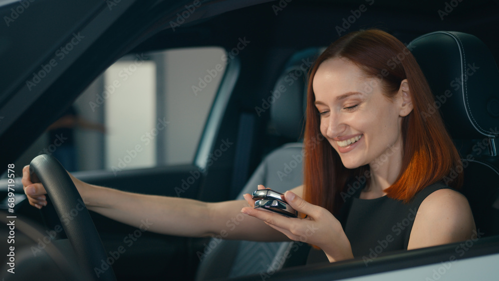 Happy smiling customer Caucasian business woman sitting inside new car smile client buyer female driver owner girl in luxury vehicle in automobile salon store auto rent transport buying showing key