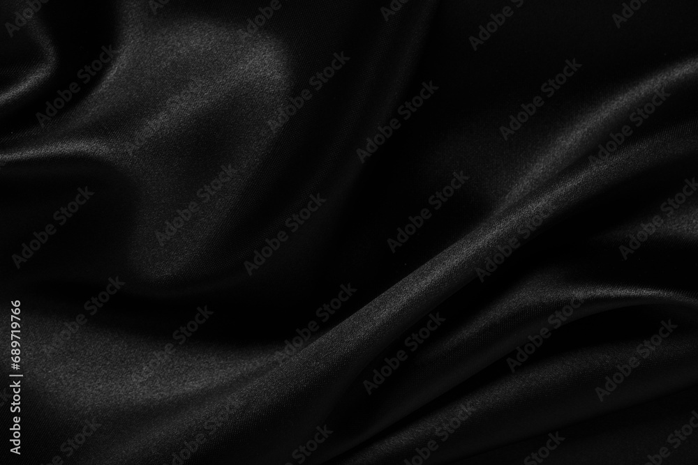 Fototapeta premium Background with black silk fabric.