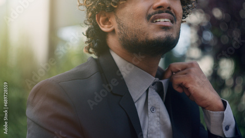 Fotografie Tired exhausted unwell bad feeling Hispanic businessman suffering high temperatu