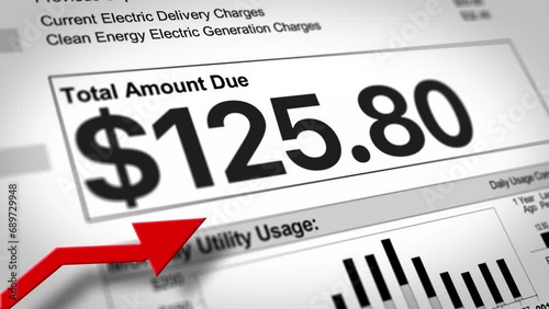 A close-up view of a household electric utility bill rising. Increasing cost of living concept.  	 photo