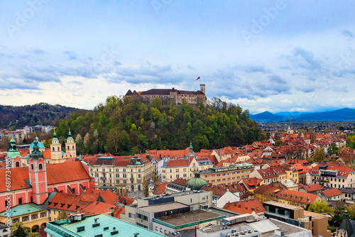 View of the old town and the medieval Ljubljana castle on top of a forest hill in Ljubljana, Slovenia photo