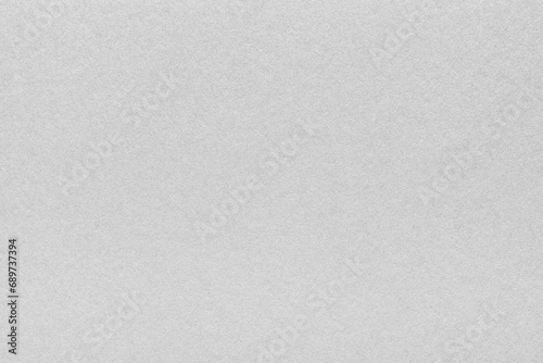 Textured glossy gray paperboard background. Horizontal scabrous cardboard background for design