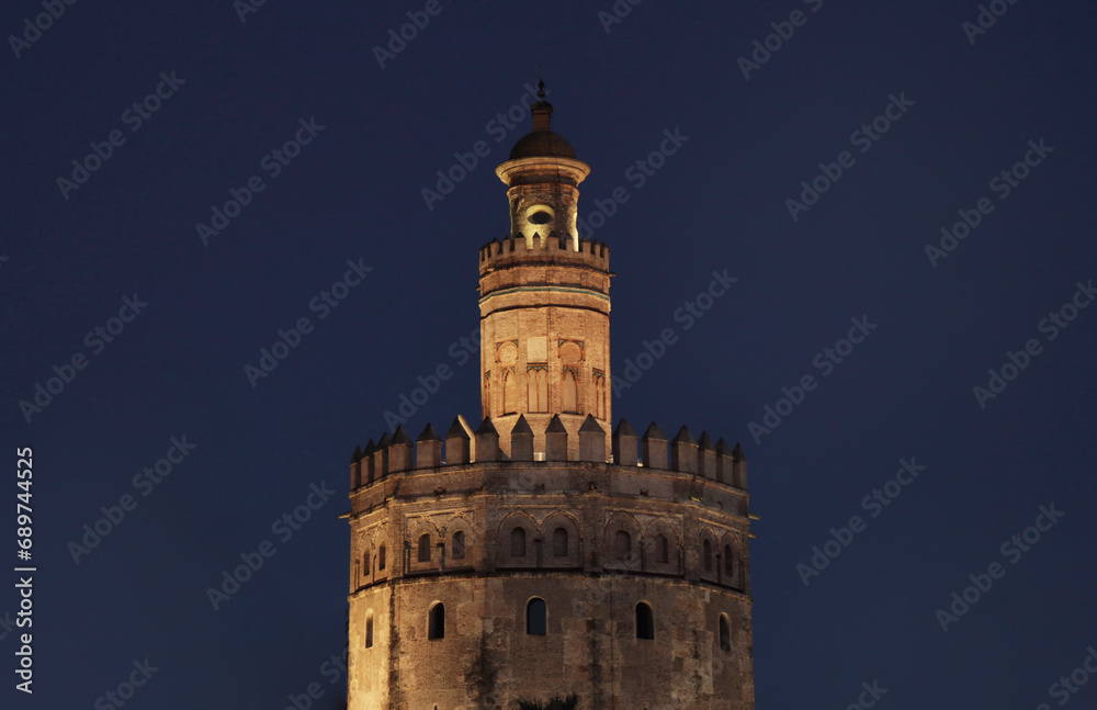 Seville, spain - november 10, 2018: Illuminated golden tower of Seville