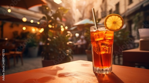 Generative AI, glass of Aperol Spritz on wooden table with blur background with lights of street bar, cafe or restaurant 