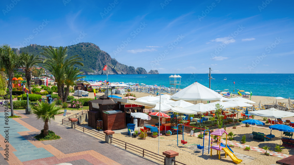 Beautiful Alanya with comfortable beach, green palm trees and blue sea in Antalya Province, Turkey