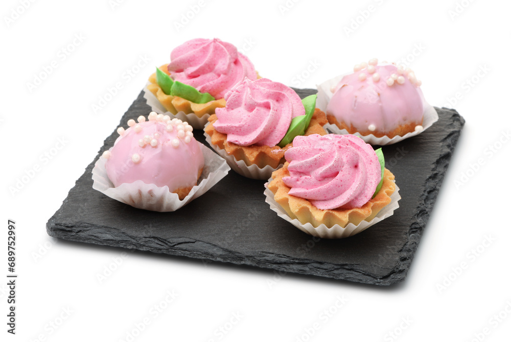 Group of mini cakes on slate plate