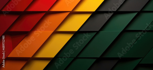 Diagonal paper stripes in Rastafarian colors against a dark, shadowed background. photo