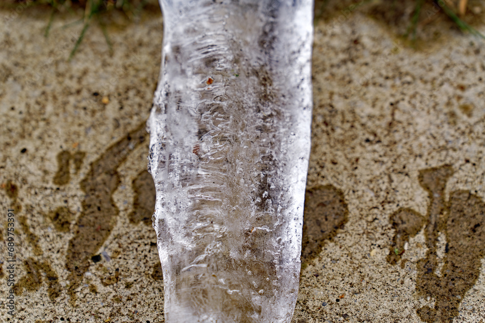 Close-up top view of big icicle lying on stone slab of terrace of apartment building at Swiss City of Zürich on a autumn day. Photo taken December 7th, 2023, Zurich, Switzerland. Close-up top view of big icicle lying on stone slab of terrace of apartment building at Swiss City of Zürich on a autumn day. Photo taken December 7th, 2023, Zurich, Switzerland.