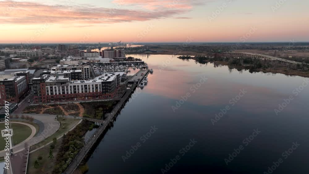 Aerial view of the Cape Fear River with Wilmington, North Carolina on the left during sunrise. Aerial view of the Cape Fear River with Wilmington, North Carolina on the left during sunrise.