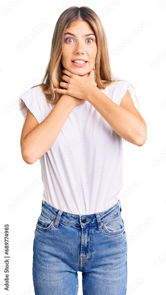 Beautiful caucasian woman with blonde hair wearing casual white tshirt shouting and suffocate because painful strangle. health problem. asphyxiate and suicide concept. Beautiful caucasian woman with blonde hair wearing casual white tshirt shouting and suffocate because painful strangle. health problem. asphyxiate and suicide concept.