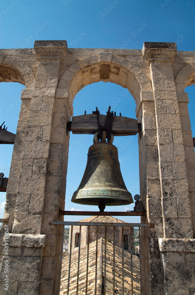 One or bells on bell tower of church Chiesa di San Carlo al Corso in Sicily, Italy