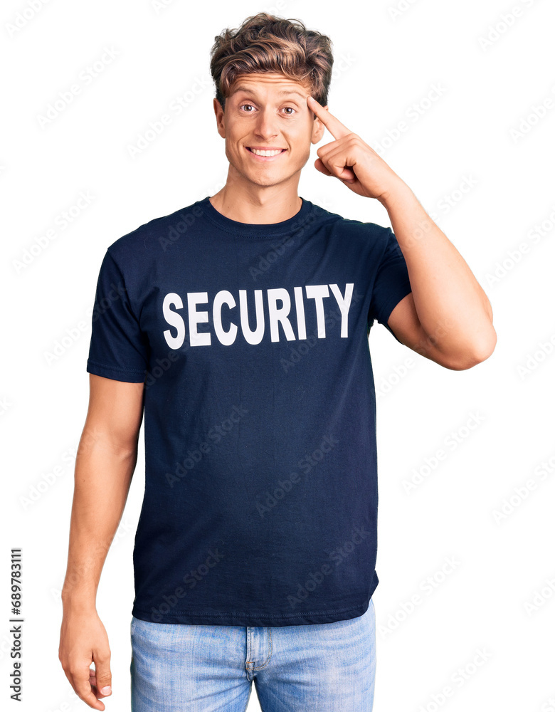 Young handsome man wearing security t shirt smiling pointing to head with one finger, great idea or thought, good memory Young handsome man wearing security t shirt smiling pointing to head with one finger, great idea or thought, good memory