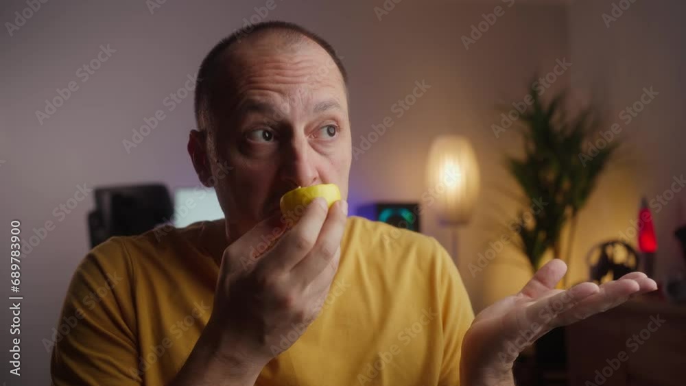 Anosmia or smell blindness, loss of the ability to smell, one of the possible symptoms of covid-19, infectious disease caused by corona virus. Man Trying to Sense Smell of a Lemon Anosmia or smell blindness, loss of the ability to smell, one of the possible symptoms of covid-19, infectious disease caused by corona virus. Man Trying to Sense Smell of a Lemon