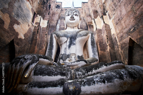 Old statue of buddha in sukhothai, thailand