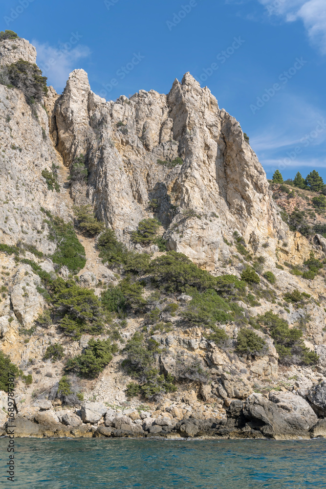  steep rocky cliffs near Maddalena cape, Argentario, Italy