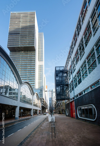 street on kop van zuid and skyscraper by oma architects in rotterdam photo