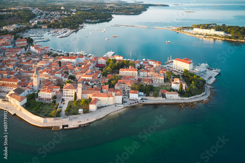 Panoramic scenic aerial view of the old year in Venetian style on a peninsula surrounded by the sea in the early morning. Poreč, Croatia. Shooting from a drone.