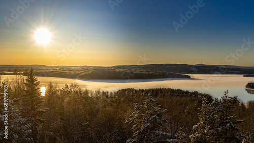Stunning image of the sun setting over Lekomberget outside Ludvika city in Sweden