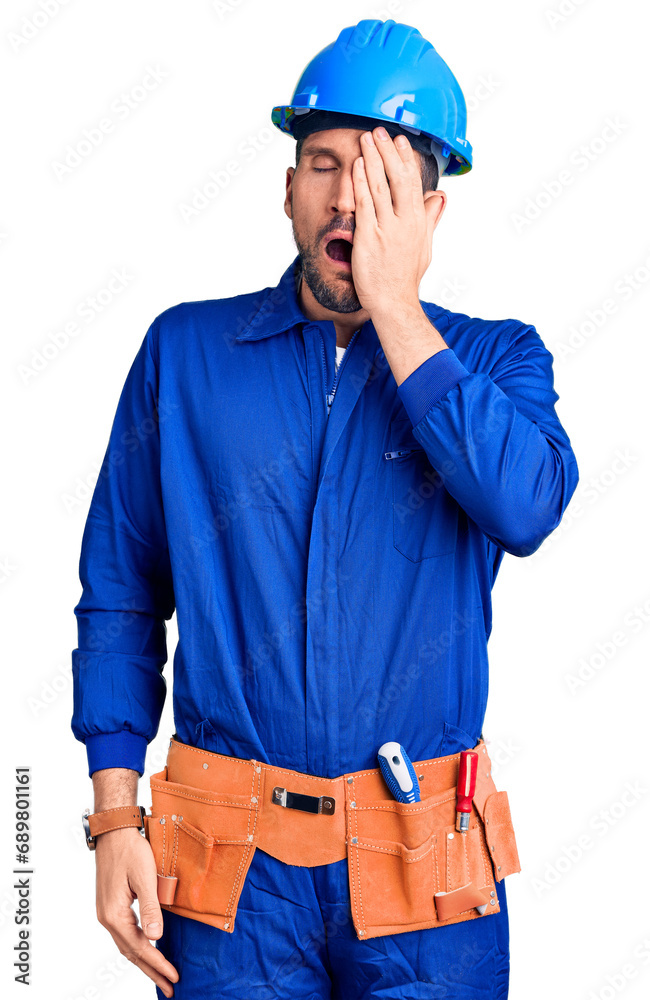 Young handsome man wearing worker uniform and hardhat begging and praying with hands together with hope expression on face very emotional and worried. begging. Young handsome man wearing worker uniform and hardhat begging and praying with hands together with hope expression on face very emotional and worried. begging.