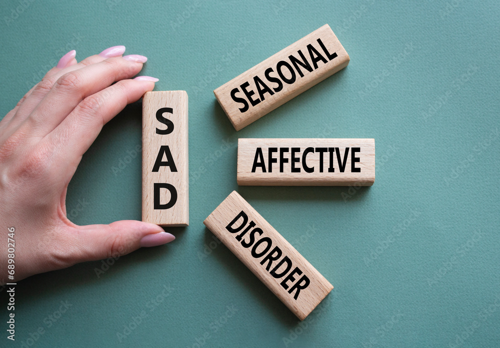 Sad Seasonal Affective Disorder symbol. Wooden blocks with words Sad