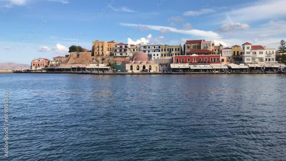 Chania, Greece - November 25, 2019: View of the old harbor of Chania with mosque. Crete.