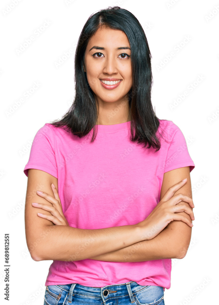 Beautiful asian young woman wearing casual pink t shirt happy face smiling with crossed arms looking at the camera. positive person. Beautiful asian young woman wearing casual pink t shirt happy face smiling with crossed arms looking at the camera. positive person.