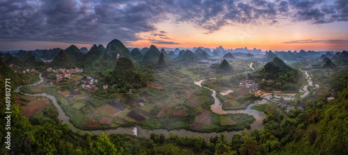 Aerial view of Guilin mountain landscape at sunrise with fog, Guangxi, China. photo