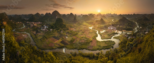 Aerial view of Guilin mountain landscape at sunrise with fog, Guangxi, China. photo