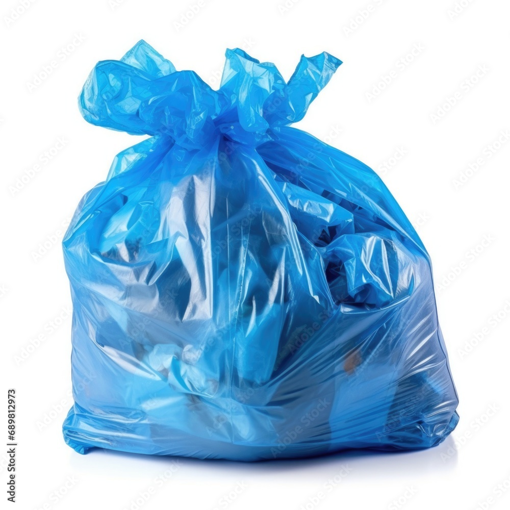 A blue bag of garbage on a white surface.