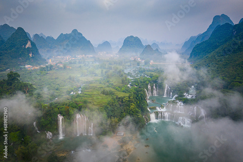 Aerial view of Ban Gioc Detian Falls along the Quay Son River on the Karst hills of Daxin County, Guangxi, China. photo