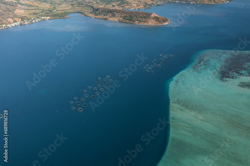 Aerial view of fish farm off the coastline in the ocean sea water, Grand Sable, Flacq District, Mauritius.