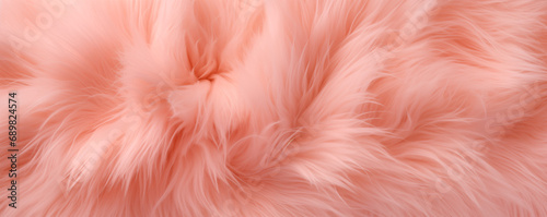 Close-up shot of peach fuzz soft fluffy long-haired colored fur. Banner with trending color of  the year 2024. Flat lay horizontal background. Fancy backdrop for party invitation. photo