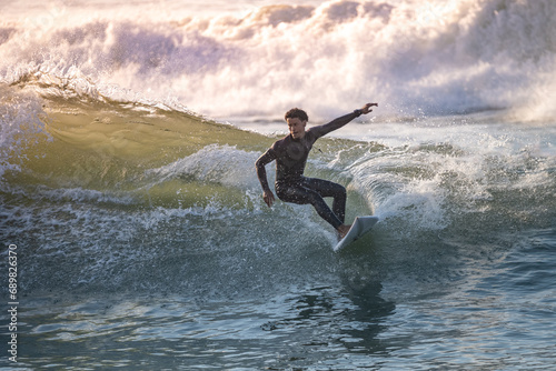 Sporty boy riding his surf board
