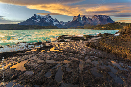 View of the Andes mountain range from the lakeside at sunset, Chile. photo