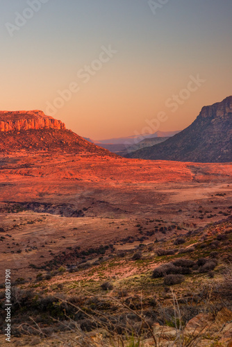 Hills in the Lesotho mountains glow red at sunset