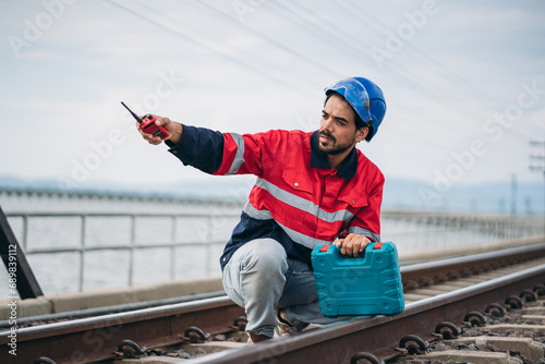 Service Engineer inspecting and maintenance railroad tracks. Industrial Worker checking and working of machines.