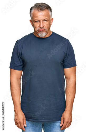 Middle age grey-haired man wearing casual clothes depressed and worry for distress, crying angry and afraid. sad expression.