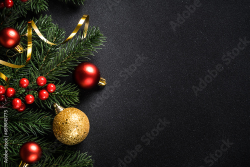 Christmas background, holiday decorations on black. Flat lay with copy space.