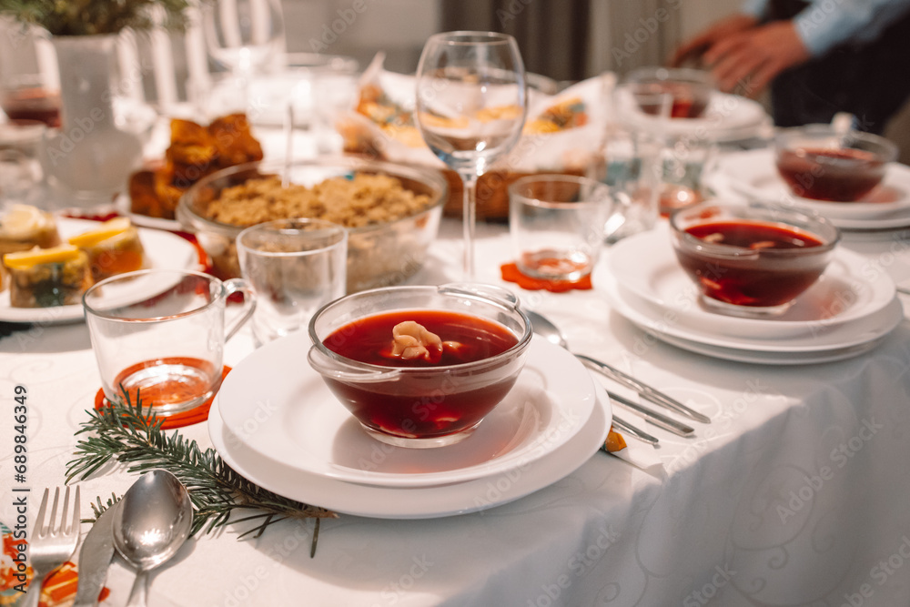 Red borscht with ravioli stuffed with sauerkraut and mushrooms and other traditional Polish Christmas Eve dishes Red borscht with ravioli stuffed with sauerkraut and mushrooms and other traditional Polish Christmas Eve dishes