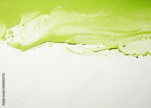 Vibrant green paint splashes across a white background, full of energy and movement. Empty space for text.