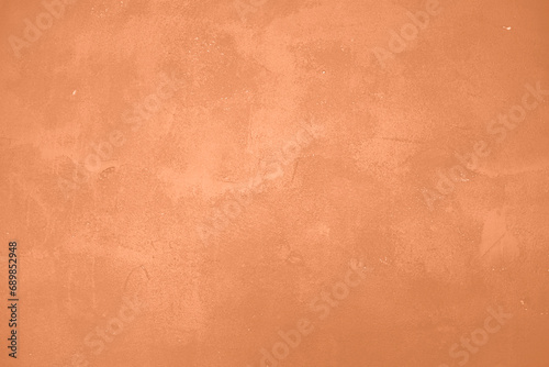 Peach Fuzz toned colour grunge decorative wall background. Art rough stylized texture banner trendy color 2024. Grunge Peach Fuzz color texture photo
