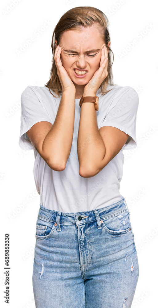 Beautiful young blonde woman wearing casual white t shirt with hand on head, headache because stress. suffering migraine. Beautiful young blonde woman wearing casual white t shirt with hand on head, headache because stress. suffering migraine.