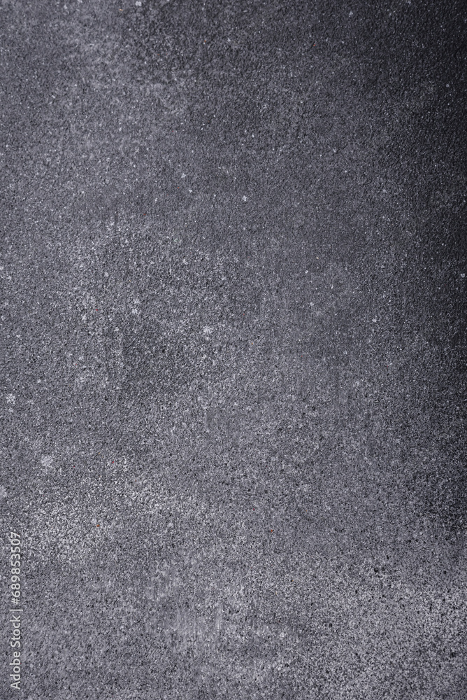 Fototapeta premium Texture of a concrete wall with cracks and scratches which can be used as a background