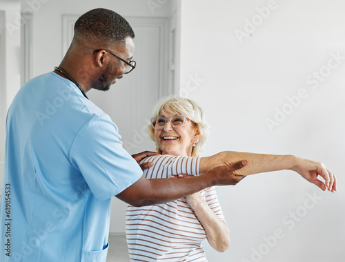 senior care exercise physical therapy exercising help assistence retirement home physiotherapy physiotherapist fitness gym strech clinic therapist elderly woman band stretching man photo