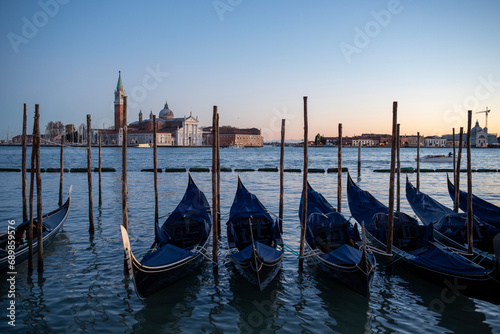 Gondolas along the Grand Canal in Venice, Italy at sunset. 