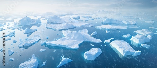 Aerial photo showing melting icebergs in a Greenland fjord.